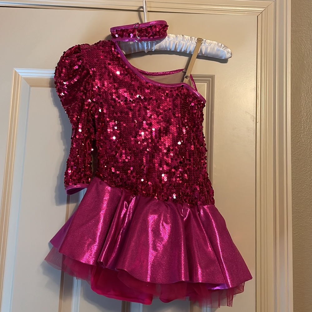 Pink puffy one sleeve Sequence with shorts.